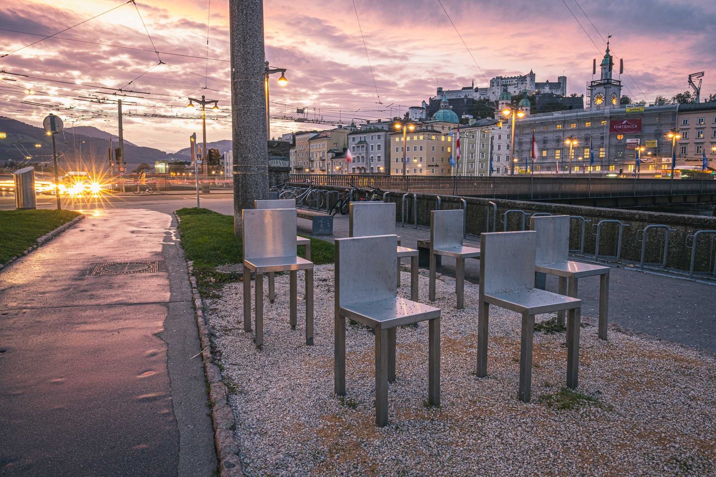 Spirit of Mozart chair sculptures by Marina Abramovic with Hohensalzburg Fortress in the distance