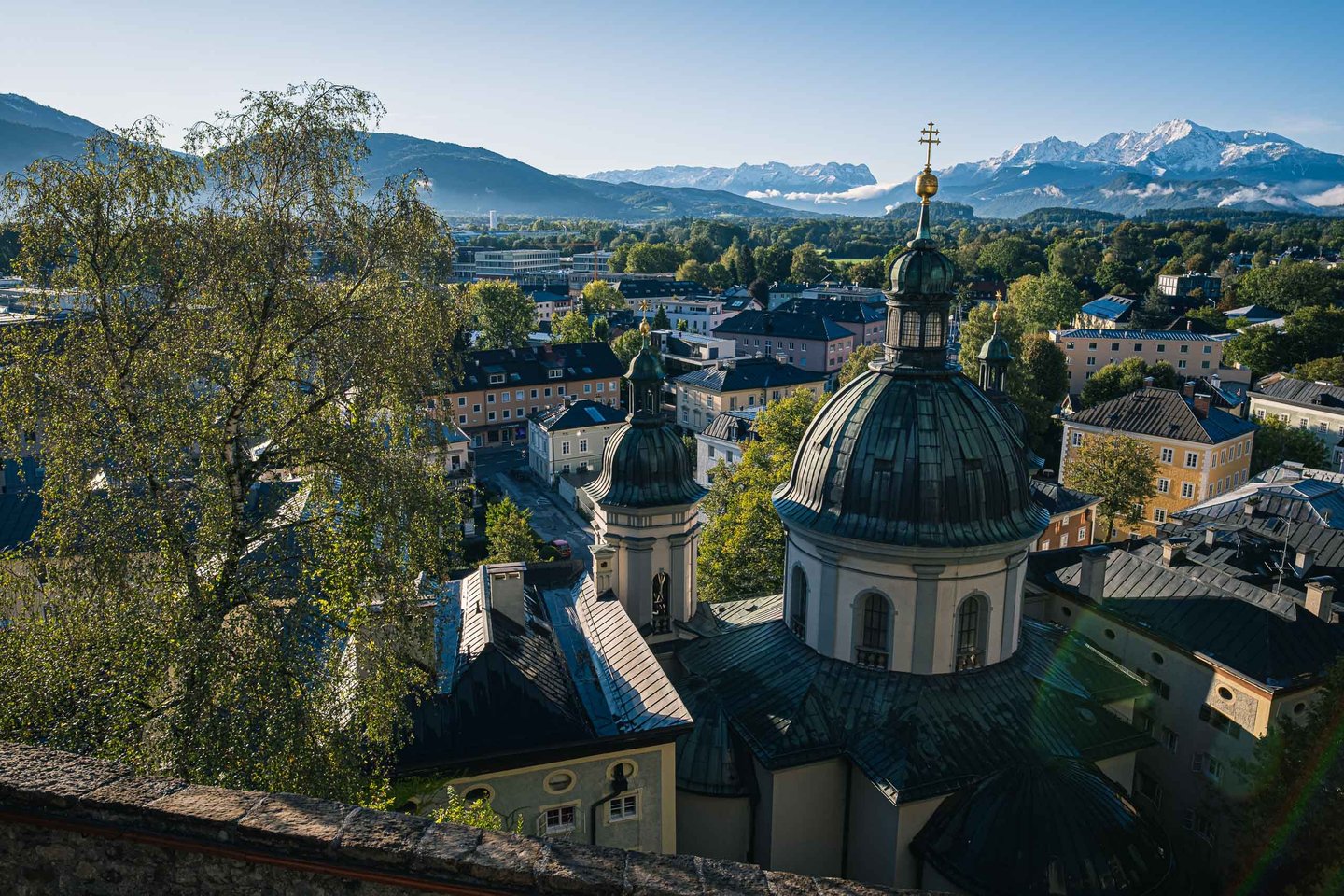 Dome of St Erhards Church in Nonntal with Untersberg range behind in Salzburg