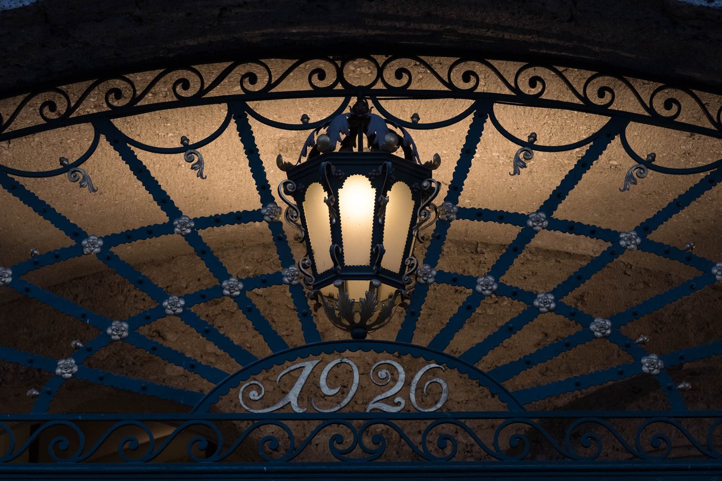 Wrought-iron arched entrance lantern at the Stieglkeller with the date 1926 in the metalwork