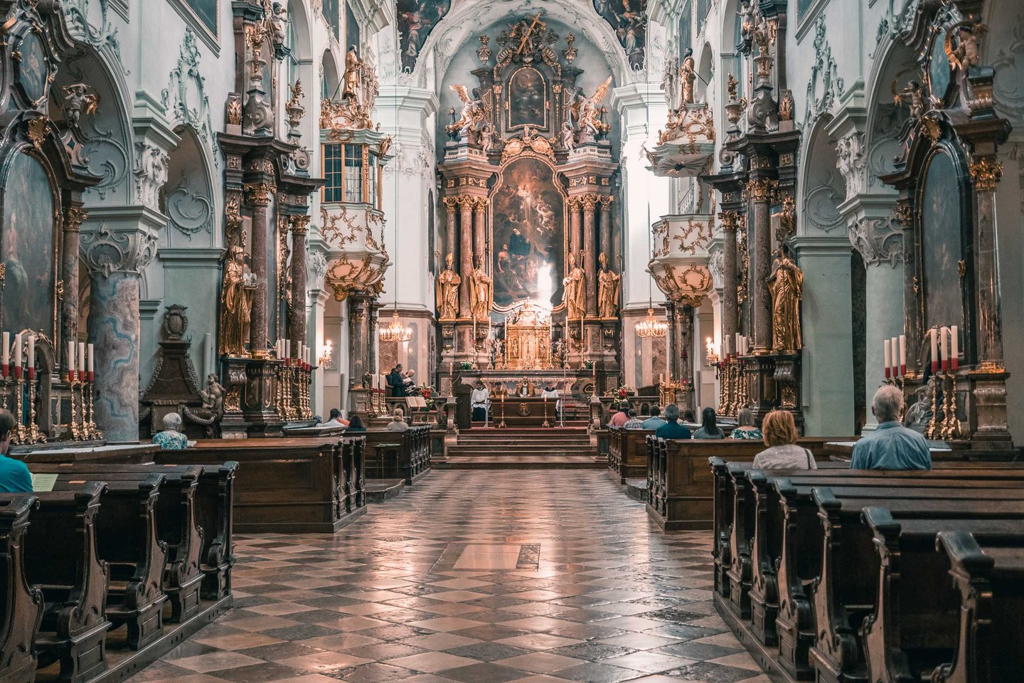 Interior nave of Stift St Peter with altar and congregation during service in Salzburg old town