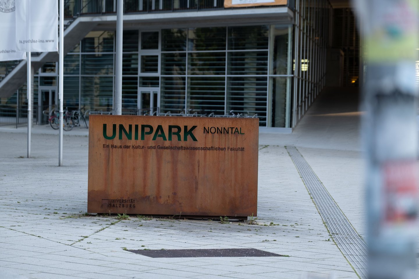 UNIPARK Nonntal corten steel entrance sign at the University of Salzburg building.