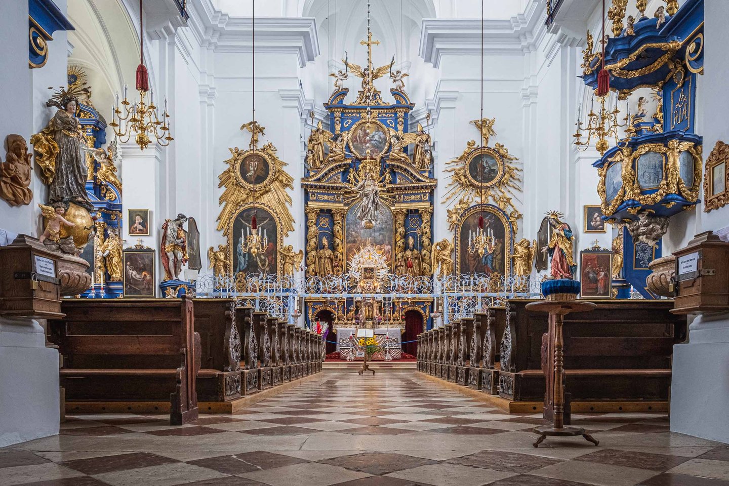 Ornate baroque interior of Wallfahrtskirche Maria Plain with blue and gold altar near Salzburg.