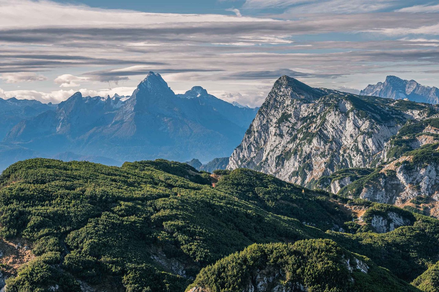 Watzmann massif silhouetted against clouds seen from a ridge near Salzburg.