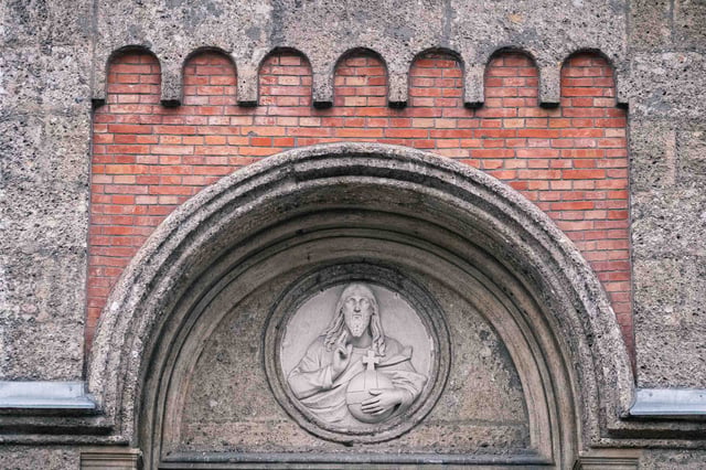 Christ relief medallion above the Christuskirche portal in Salzburg