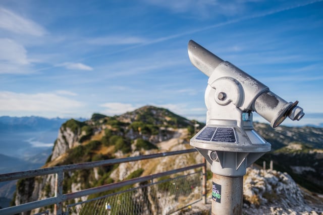 Viewing telescope on the Geiereck summit with the Salzburger Hochthron ridge behind on the Untersberg.