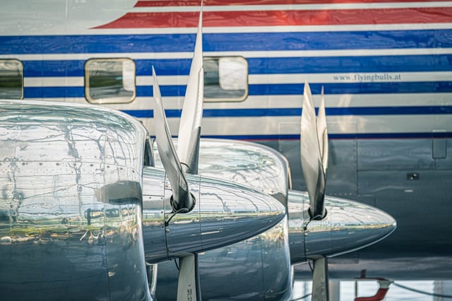Polished propellers and a Flying Bulls fuselage with the flyingbulls.at logo on display at Hangar-7 in Salzburg.