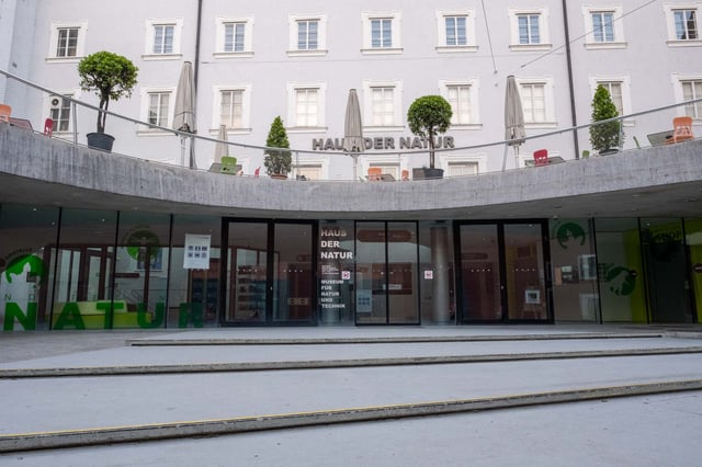 Haus der Natur museum entrance with curved concrete canopy in Salzburg old town