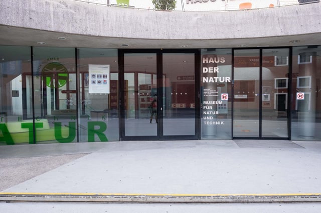 Haus der Natur glass entrance doors with Museum fur Natur und Technik signage in Salzburg