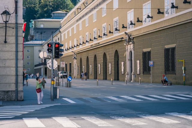 Hofstallgasse with former court stables facade and horse sculptures beside Felsenreitschule in Salzburg