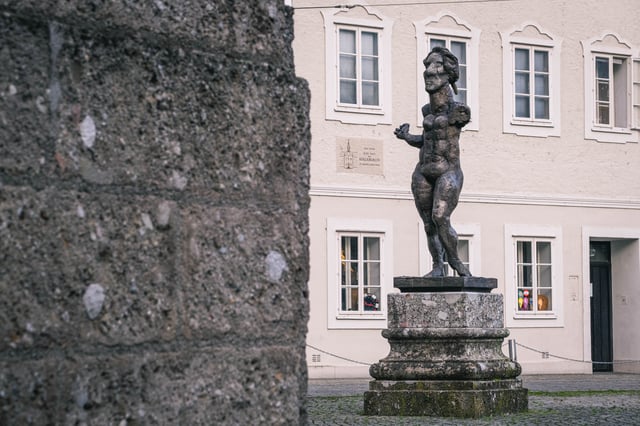 Homage to Mozart bronze figure by Markus Luepertz at Ursulinenplatz courtyard in Salzburg