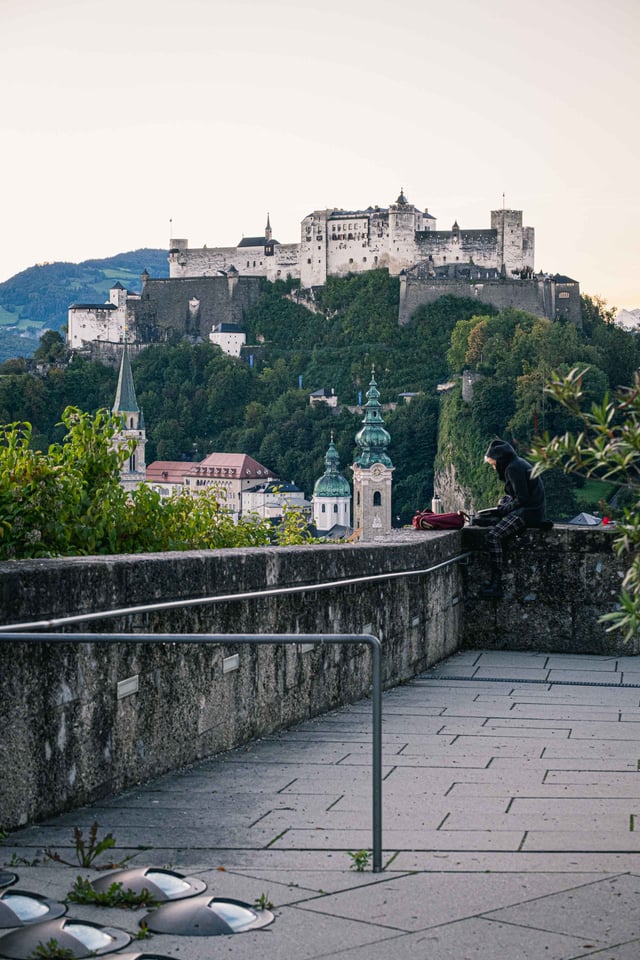 Morning view of Hohensalzburg Fortress and Altstadt church spires from the Humboldtterrasse on the Monchsberg in Salzburg