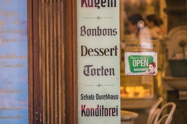 Schatz Konditorei vintage window sign listing Bonbons Dessert Torten in Salzburg