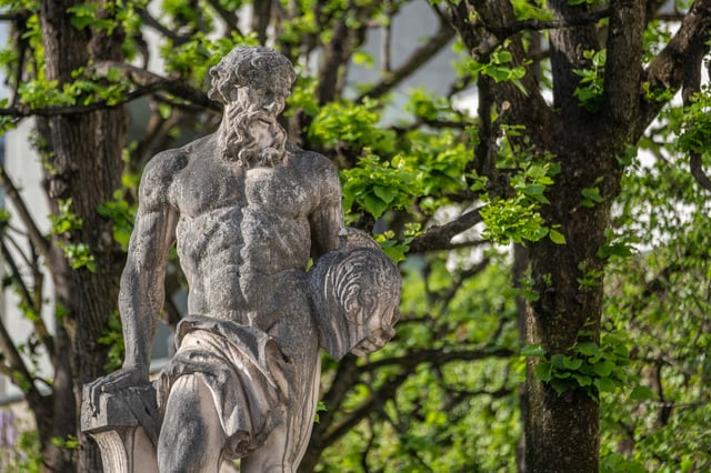 Stone statue of Ares the god of war at the entrance gate to Mirabell Gardens in Salzburg