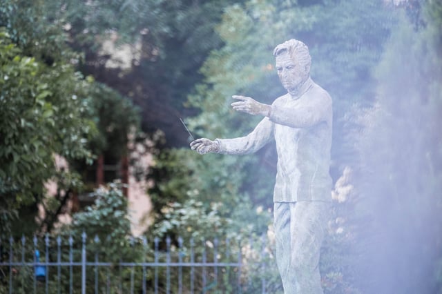 Bronze Herbert von Karajan statue near Mozart's Birthplace at Makartsteg in Salzburg
