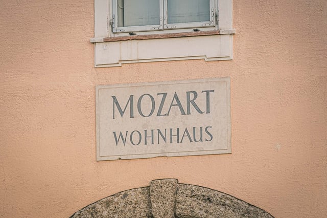 Mozart Wohnhaus stone plaque on facade of Mozart Residence on Makartplatz in Salzburg