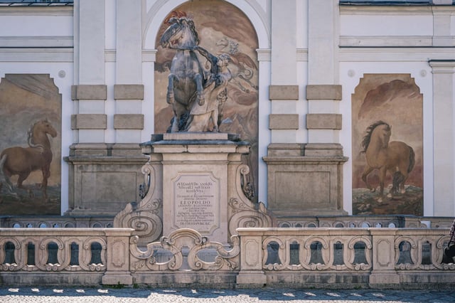Pferdeschwemme horse trough monument with rearing horse statue and flanking frescoes in Salzburg
