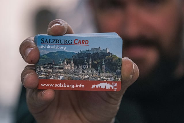 Close-up of a Salzburg Card with the fortress graphic held up in Salzburg