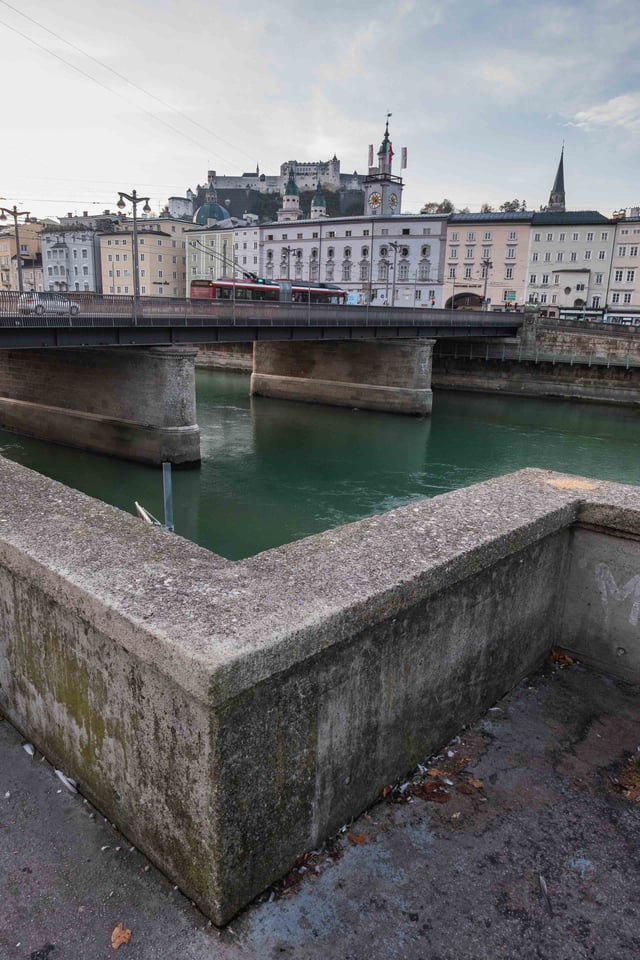 Staatsbrucke bridge across the Salzach with Hohensalzburg fortress and old town behind in Salzburg